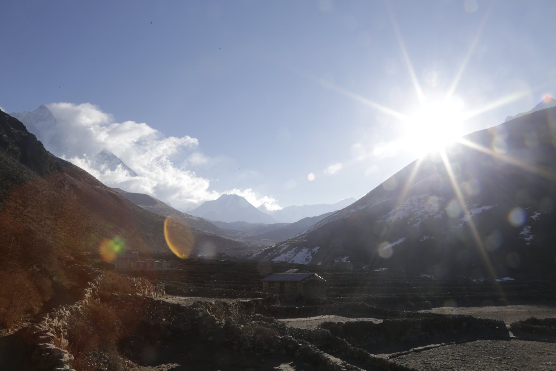 Morning sunlight breaking over the mountain valley