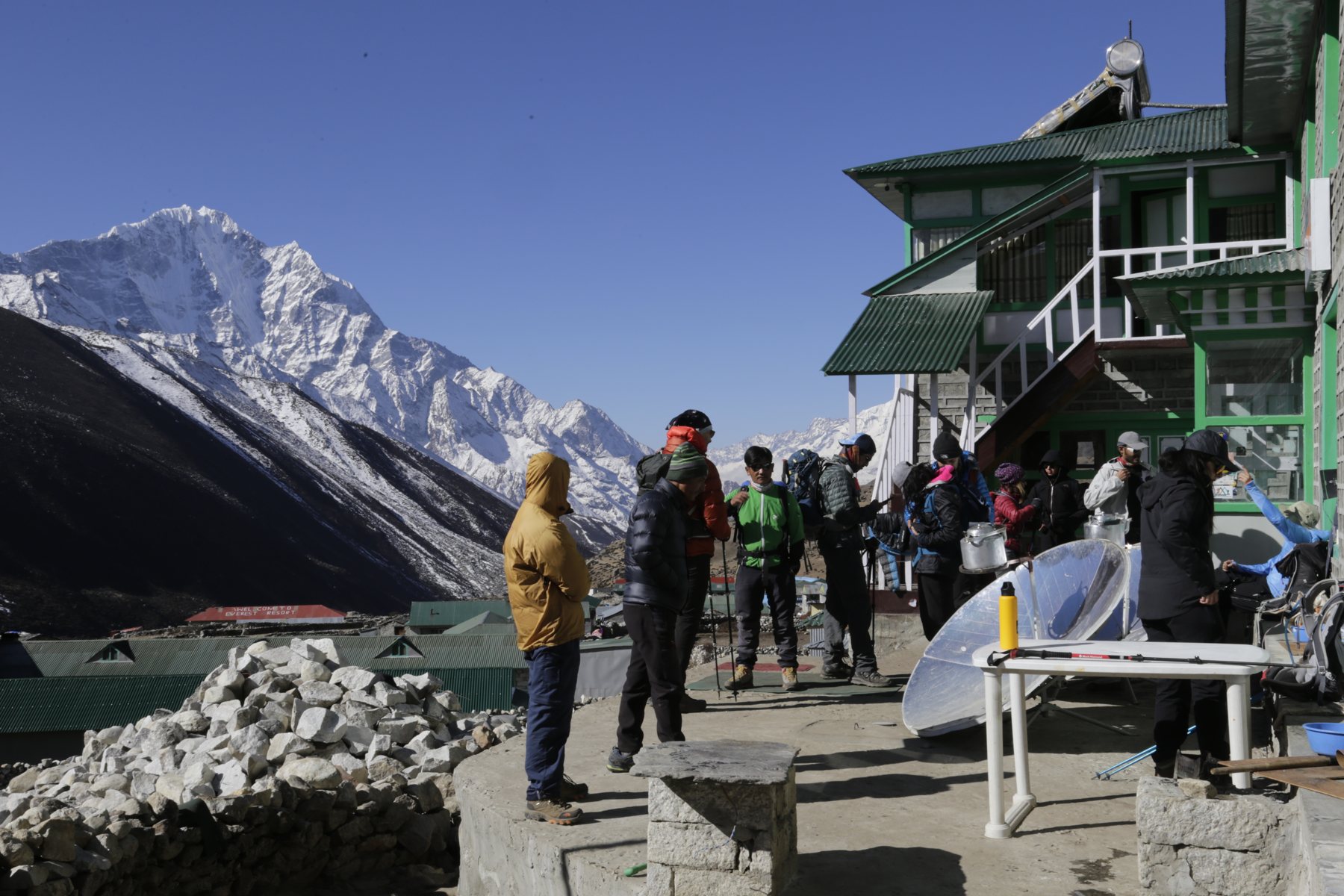 Trekkers setting off together from a mountain lodge